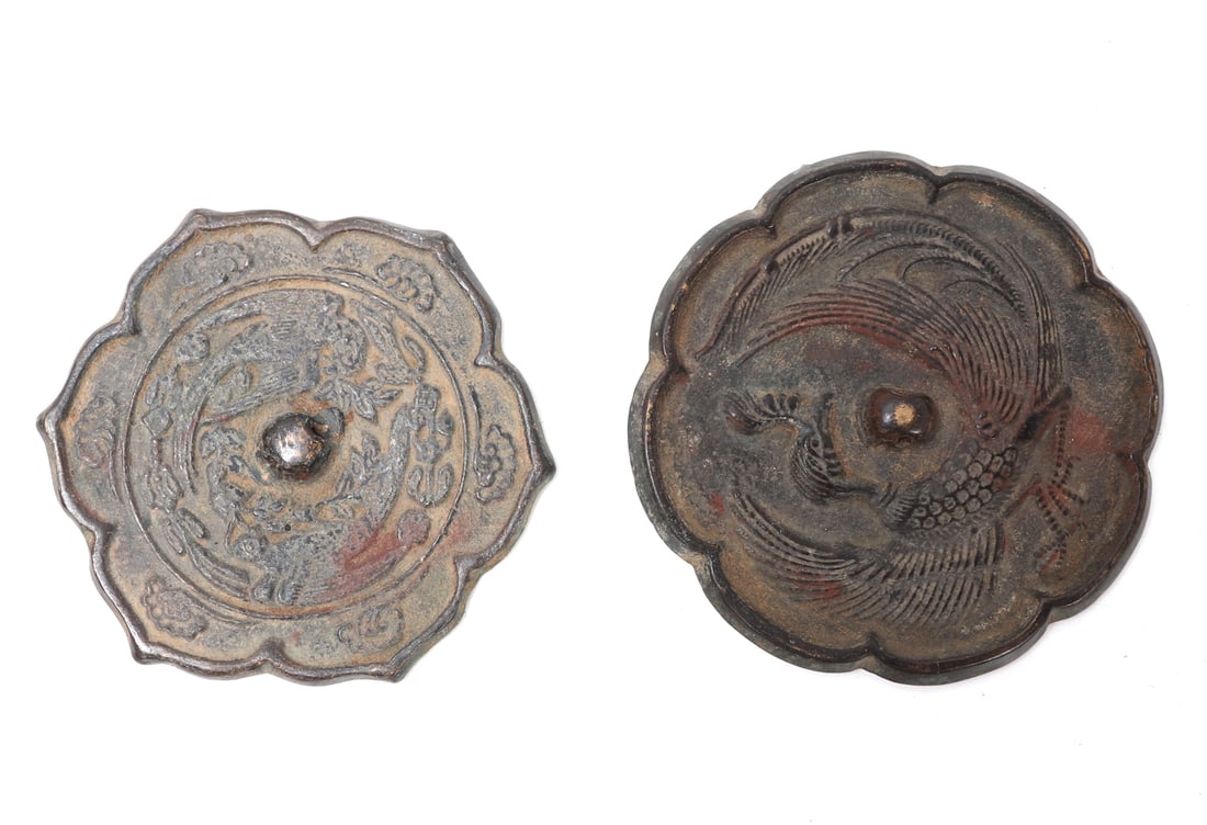 Chinese Bronze Phoenix Mirrors: Two Chinese bronze mirrors of rare form with low relief depictions of coiled phoenix. Size 4" L x 4" W x 1/8" H weight 136gEx-Pasadena Collection