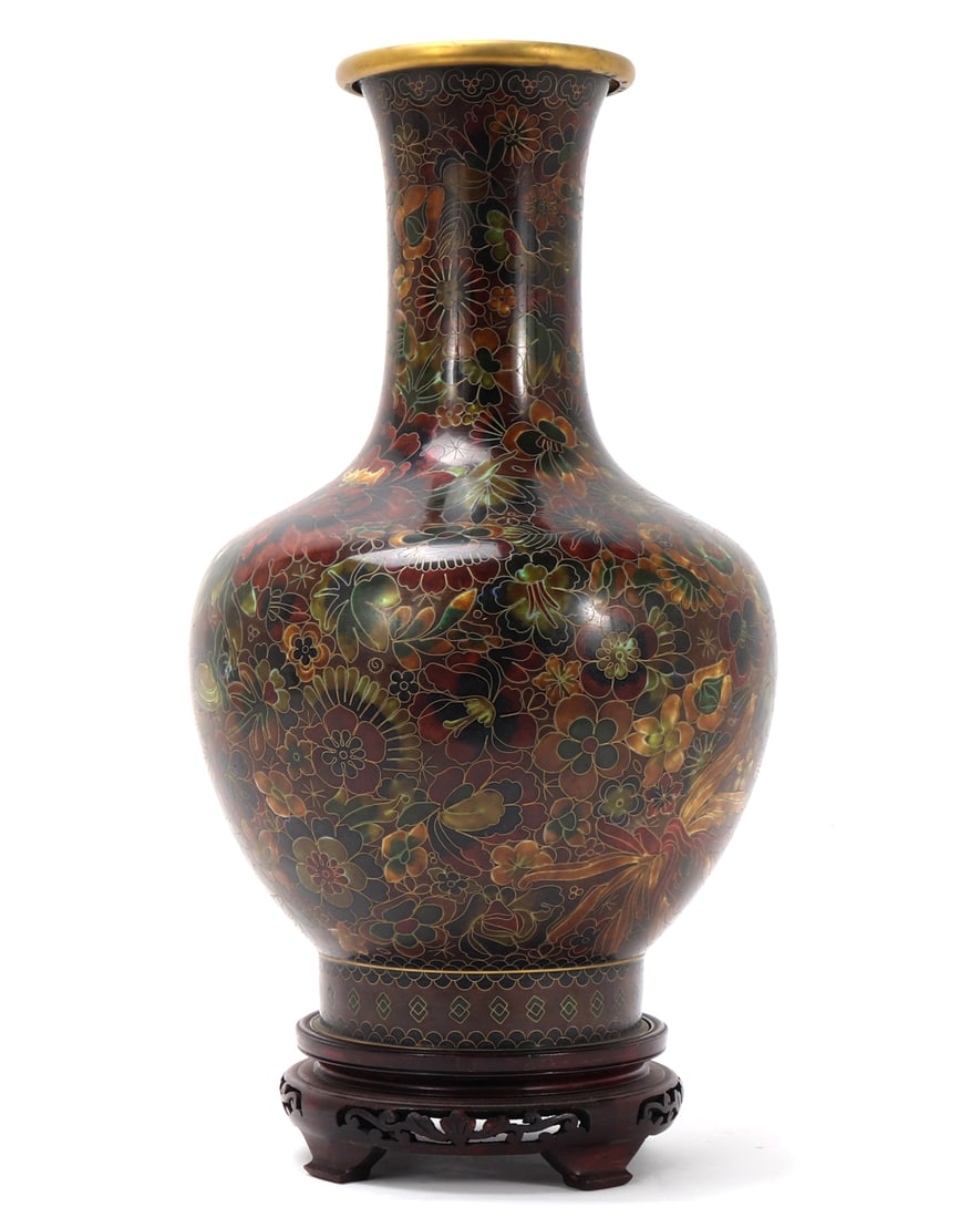 Beautiful Chinese Cloisonne Vase with Stand: Wonderful Chinese cloisonne mille fleur vase with a large bulbous body, long corseted neck with a flared rim. Pedestal style base with a repeated design throughout. Brown background with warm red,