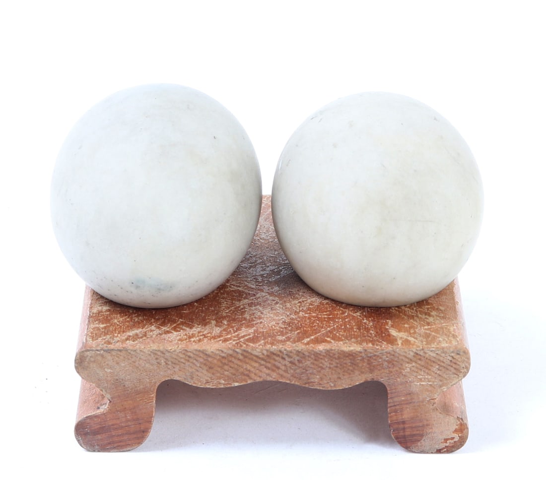 Chinese White Palm Stones w/Stand: Pair of Chinese white hardstone palm stones for meditation. Included with a custom stand for display on a mantel or windowsill to charge the stones. Size Each 2" L, Weight 71 g