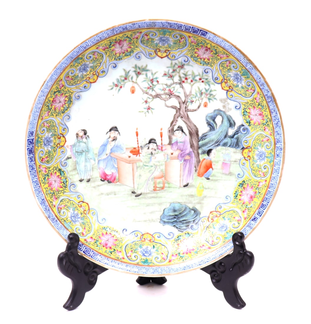 Qing Dynasty Famille Rose Porcelain Charger: Chinese Qing Dynasty, 1644 to 1912. Lovely Chinese porcelain charger, depicting immortals among a field with blooming trees in the background. A child waits for the teakettle to boil for tea.