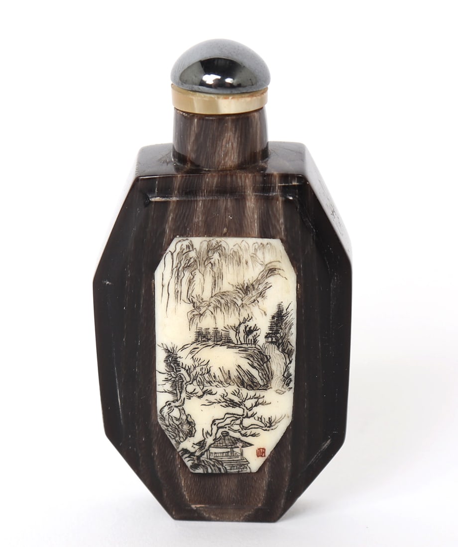 Lovely Chinese Carved Snuff Bottle: Finely detailed Chinese snuff bottle with inlayed bone. On the face, inlayed bone with a landscape scene carefully carved and detailed. On the reverse painted in gold is a incised bronze Ju vessel,