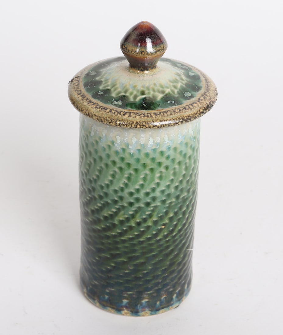 Vintage Signed Green Glazed Covered Jar: Tall slender green glazed vase with lid, and scale like detail. Size 7 1/2" H