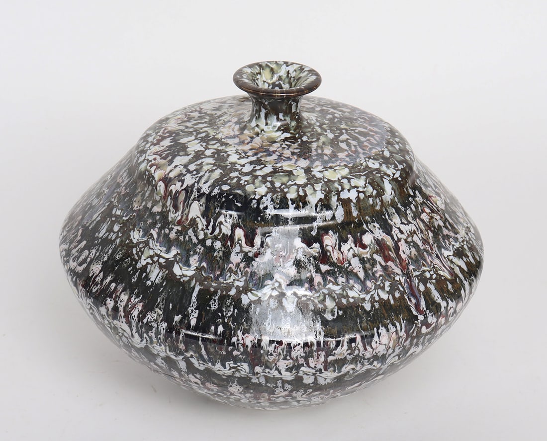 Decorative Ceramic Vase: Decorative ceramic vase with brown and white modern design. Size 9 3/4" L