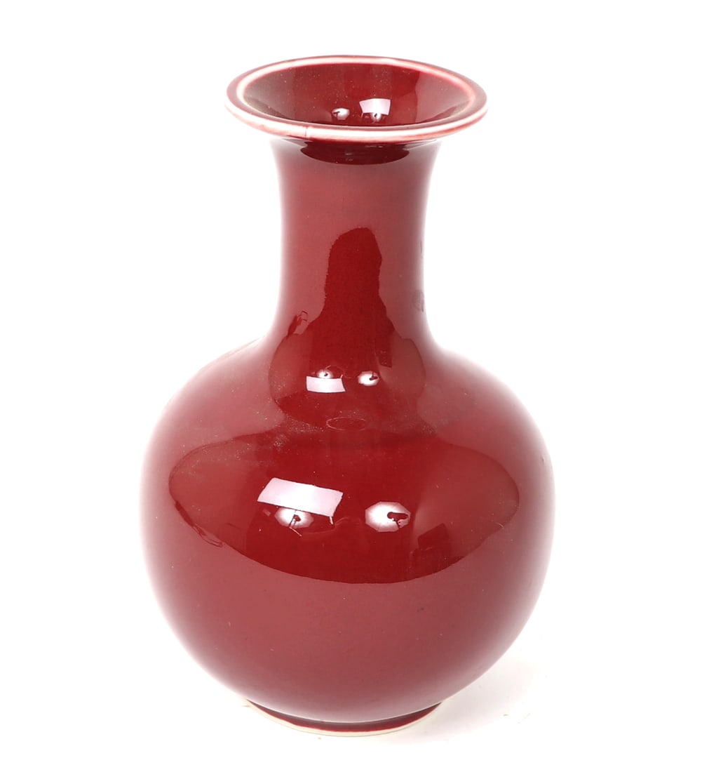 Chinese Oxblood Style Vase: Chinese ox blood style glazed vase with a bulbous body long narrow neck and flared rim with a white stripe to the lip. Size 9" H