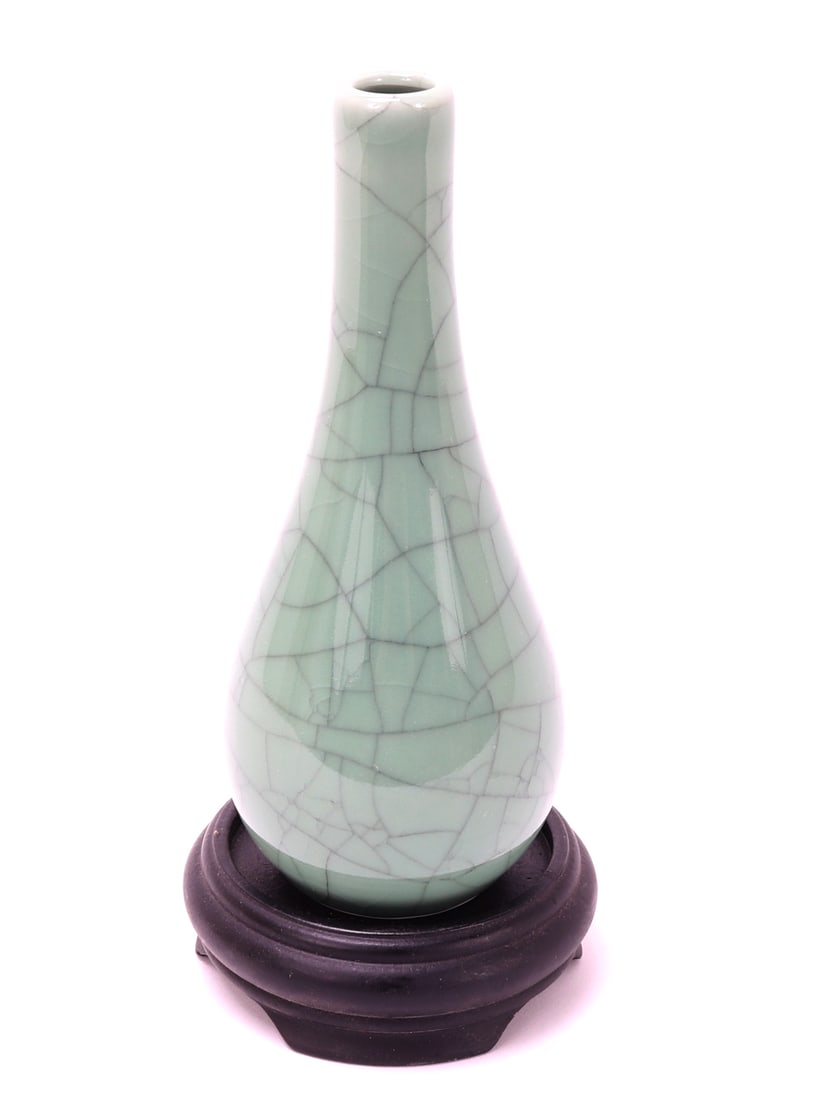 Chinese Crackle Glazed Vase w/Stand: Nice Chinese light green crackle glazed porcelain vase with a custom wood stand. Bulbous body with narrow slender neck with a small opening for a single stem or small bouquet of flowers. Size 8 5/8"