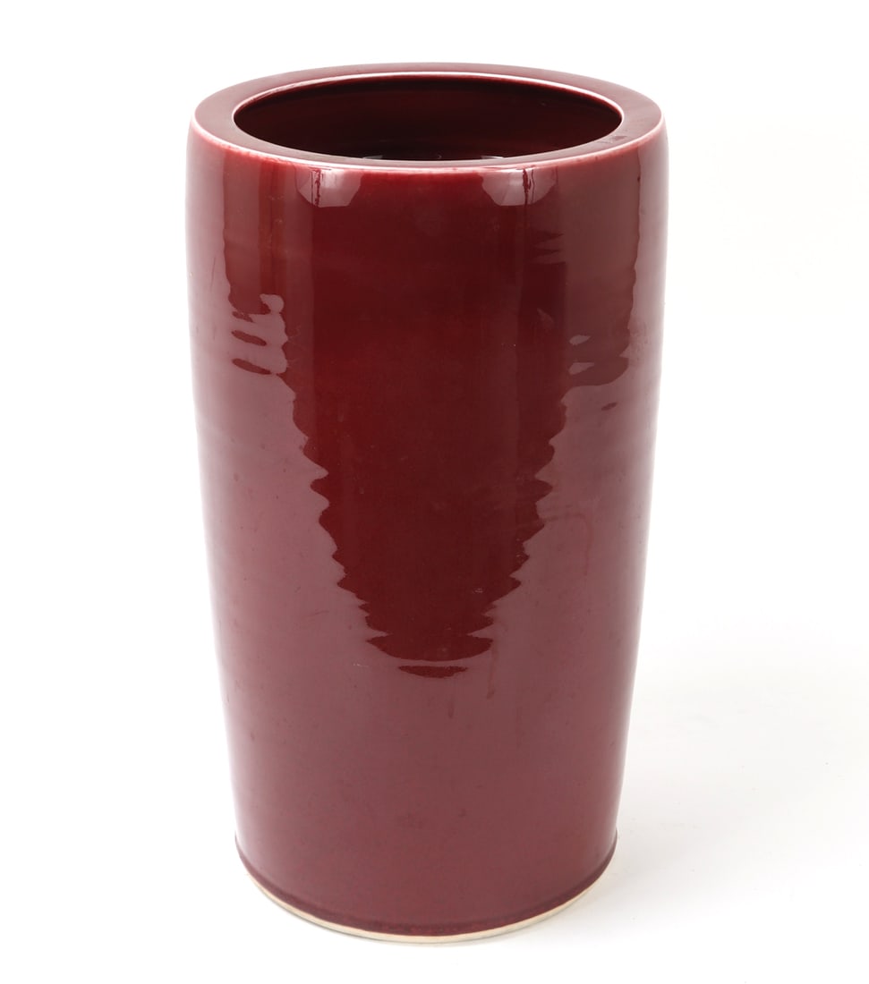 Chinese Ox Blood Glazed Porcelain Umbrella Stand: Chinese red glazed porcelain umbrella stand. Heavy porcelain umbrella stand in a deep ox blood red glaze. Size 18 1/4" H