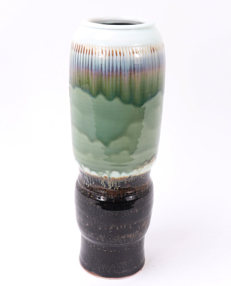 Chinese Porcelain Multicolored Glazed Vase: Beautiful Chinese porcelain cylindrical vase with a rainbow of colored glaze throughout. White, yellow, blue, purple, pink and green to the top with a brown speckled glaze to the base. Slightly narrow