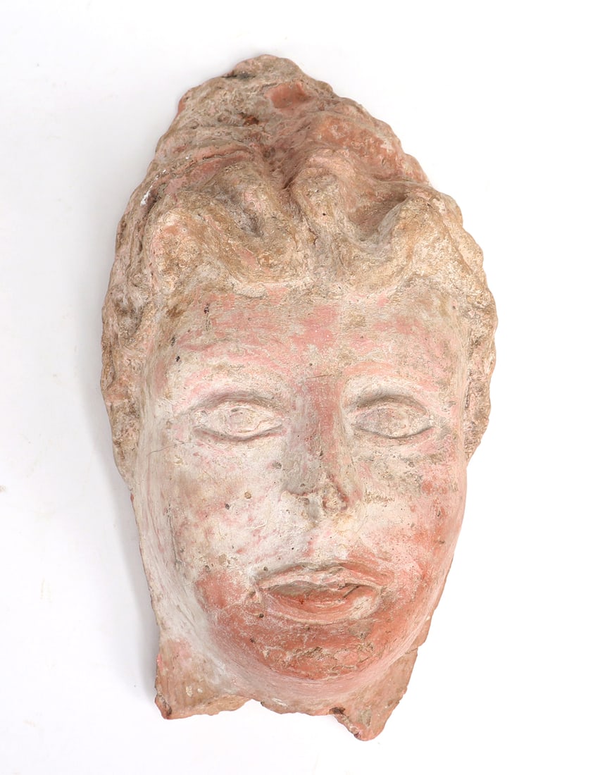 Old Terracotta Head in the Greek Style: Greek style head in terracotta depicting Aphrodite or a noble female figure, often attributed as theatre masks or decoration for pottery vessels. 11" H