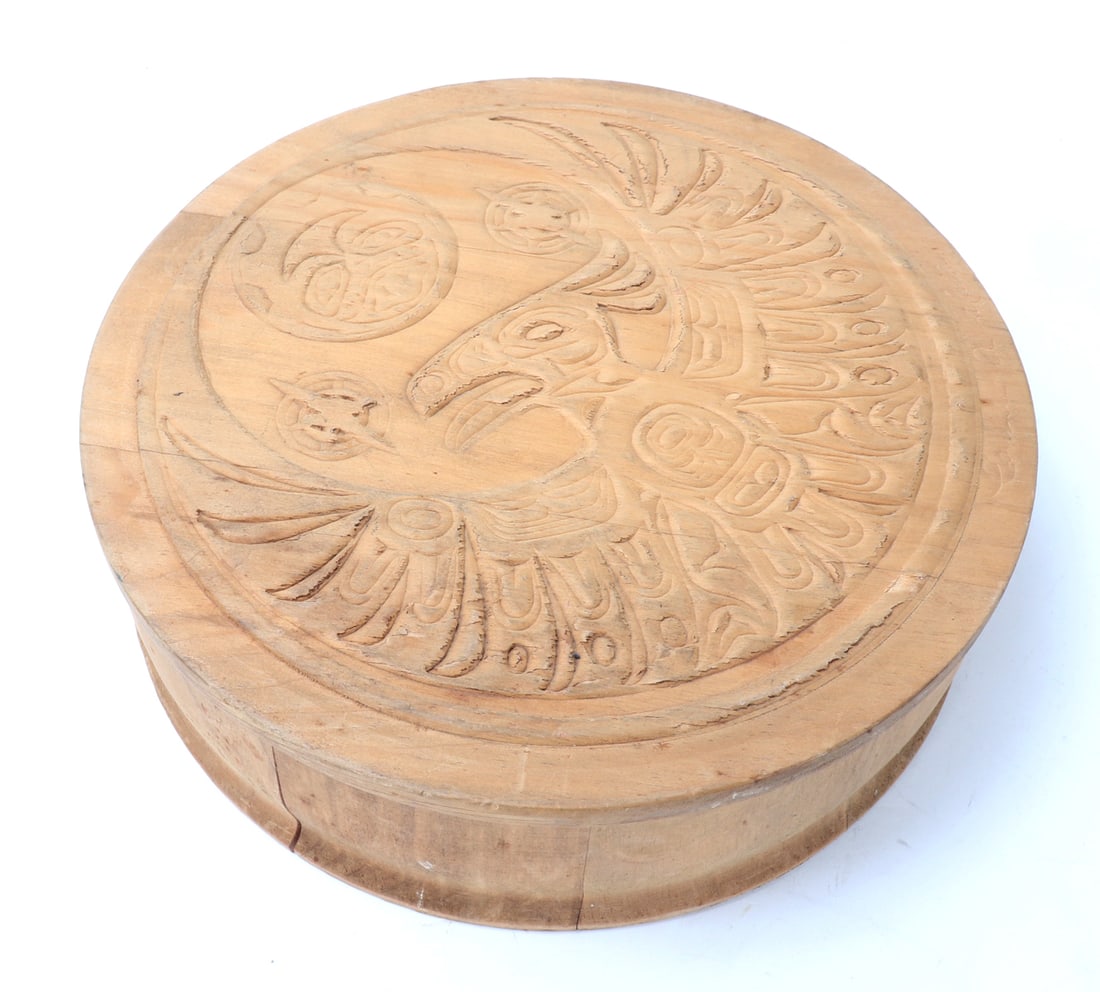 NWC Wood Carved Haida Box: Beautiful wood carved Haida box with an eagle like bird with wings spread wide and tiki face in the moon above, start burst designs to each side of the shoulders of the bird. Wide body with fairly
