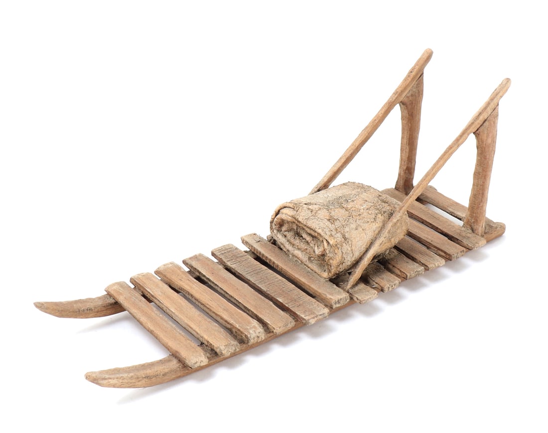Fantastic Dog Team Sled Model: Wonderfully crafted wood and hide snow dog team sled model. Elongated sled used for supplies and as a resting place during long races for the driver. Hide blanket included and affixed to the sled.