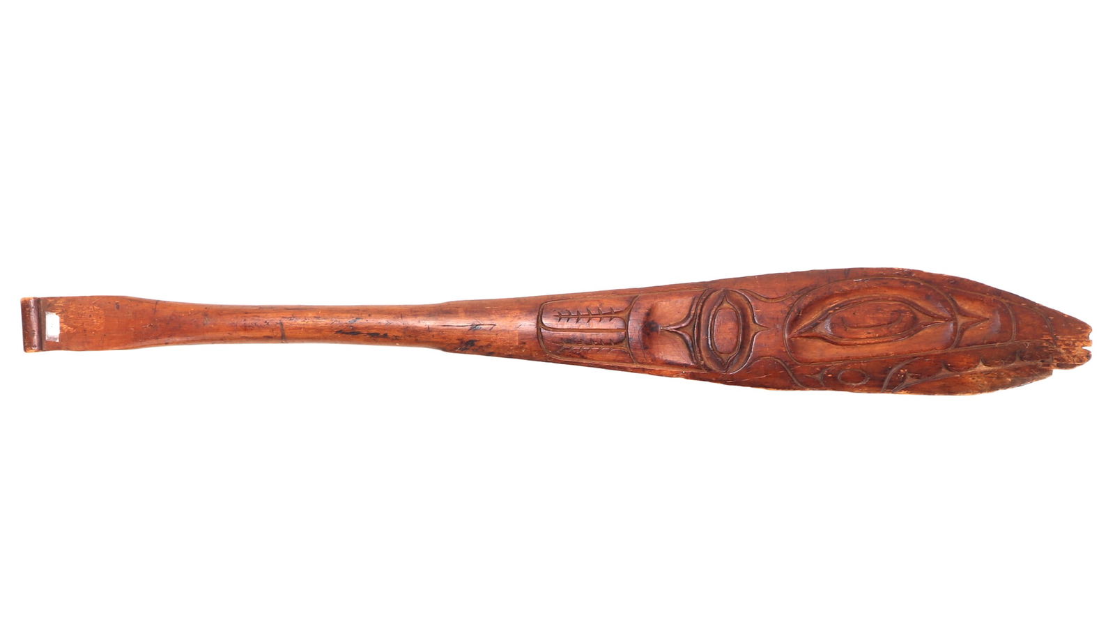 Northwest Coast Carved Wood Ceremonial Dance Paddle: Nice hand carved wood paddle either Tlingit or Haida. Incised zoomorphic whale like face to the paddle with almond shaped eyes and geometric designs. Size 27" L