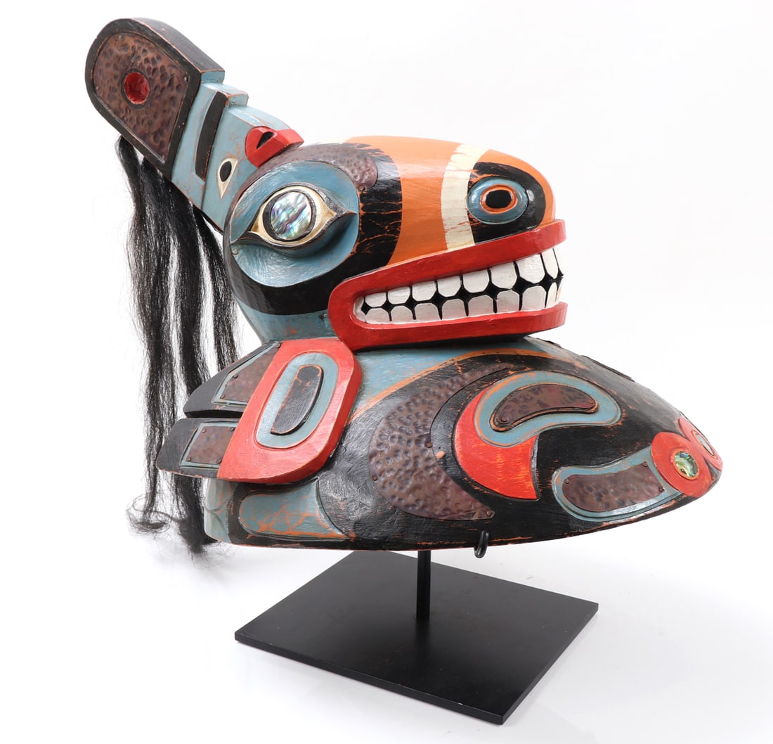 Tlingit Tribe, Chief's Ceremonial Hat: 1950's Pacific N.W. Coast Indian, Tlingit Tribe, Chief's ceremonial wood carved hat, on a custom stand. Mother of pearl inlayed eyes with long animal hair. Painted all over with light blue, red,