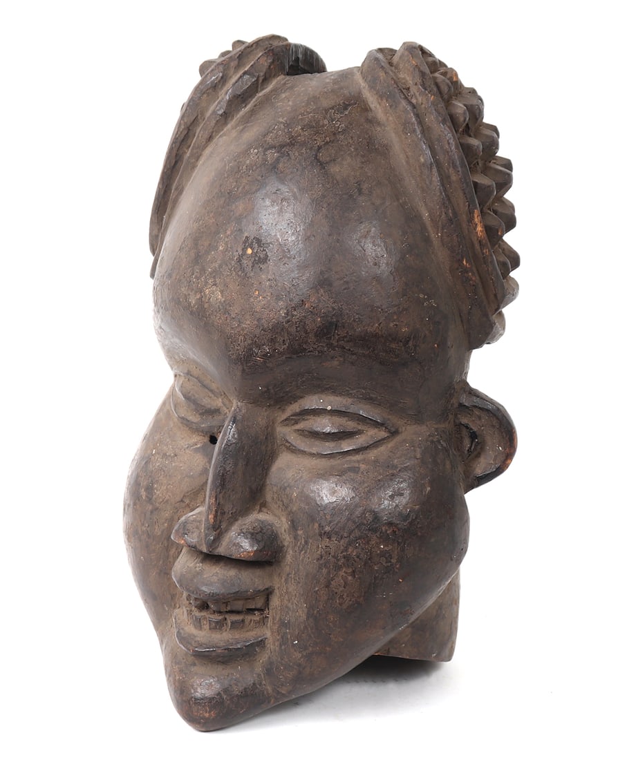 Bangwa Bamoun Ngambe Head Mask: Central Africa, Cameroon, Grassfields Kingdoms of Cameroon, Ngambe, Bangwa or more specifically probably the Bamoun peoples or Kingdom of Bamoun head / helmet mask. Hand carved mask depicts a pleasant