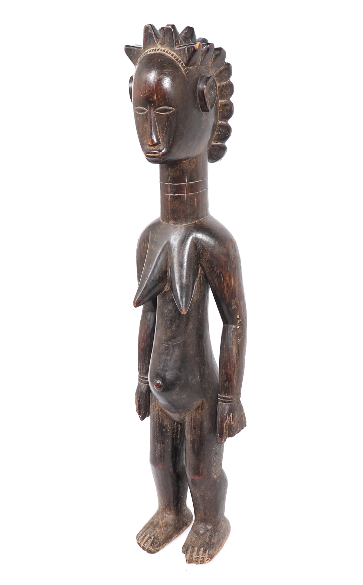 Tall African Female Carved Statue, Cote D'Ivoire: West Africa, Ivory Coast / Guinea, Republic of Guinea, 20th century. Hardwood carved pregnant female figure with a polished dark brown patina. Size 35 1/8" H, 6 1/4" WPiece collected circa early