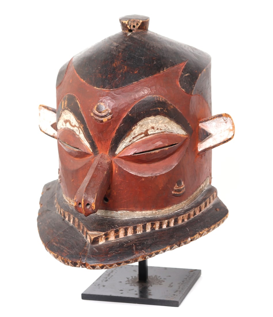 Pende Gipogo Helmet Mask, 20th c.: Democratic Republic of the Congo, Eastern Zaire, Kjasai Pende peoples. Giphogo Kipoko mask, 20th century. Carved wood helmet mask in dark red pigment and black highlights with black and white pigment