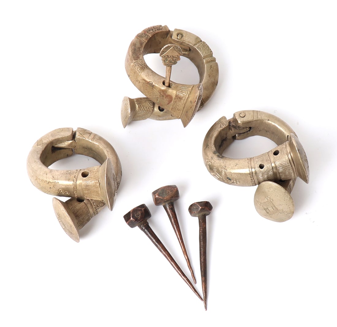 Trio of Tuareg Manilla Solid Brass Bracelets, 20th c. & Hair Pins: North Africa, Tuareg Manilla peoples 19th/20th century solid brass with high nickel content bracelets hinged to the back with a single pin. Also included are three copper Mossi people hair pins.