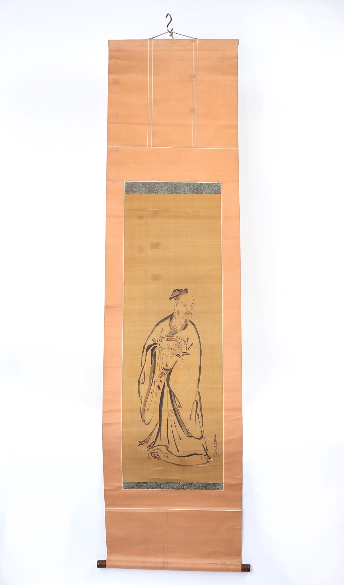 19th Century Painted Kakemono Japanese Scroll: Japanese 19th century painted and mounted scroll, depicting a monk standing wearing long flowing robes, hands together under his sleeves. He looks over his left shoulder, with a mustache and hair