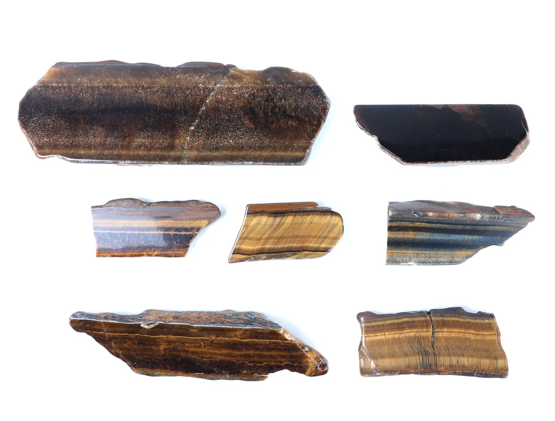 Wonderful Collection of 7 Natural Tiger's Eye Slabs: Gorgeous collection of natural raw tigers eye mineral slabs, each with wonderful gold veining throughout including the classic cats eye striping. Size 6 1/2" L, weight 249 g, box 11 3/4" L x 7 7/8" W