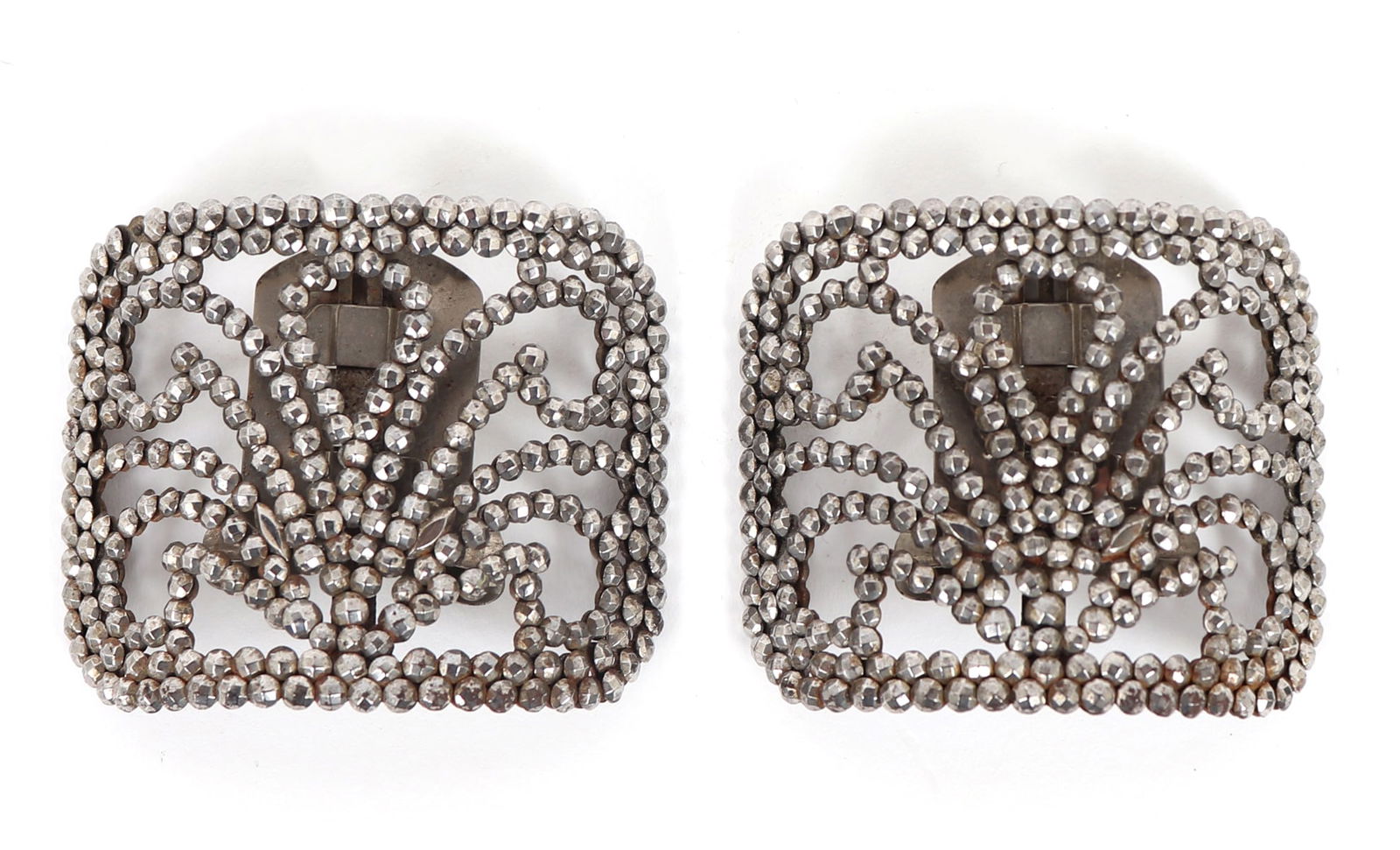 Pair of French "Boucles de Chaussures" Shoe Buckles: Fine pair of French circa 1900 - 1925 steel cut shoe buckle or "boucles de chaussures". The pattern similar to a blossoming fleur. French nobility and aristocracy frequently wore elaborate shoe
