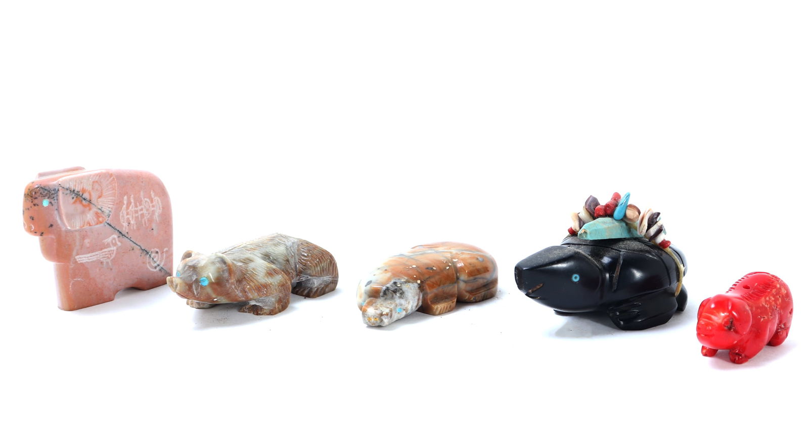 Five Hand Carved Zuni Fetish Figures: Fun group lot of five hand carved Zuni fetish figures including a light stone pink big horn sheep, a crouching bear like figure, possible platypus, a turtle and pig. Most with turquoise inlayed eyes,