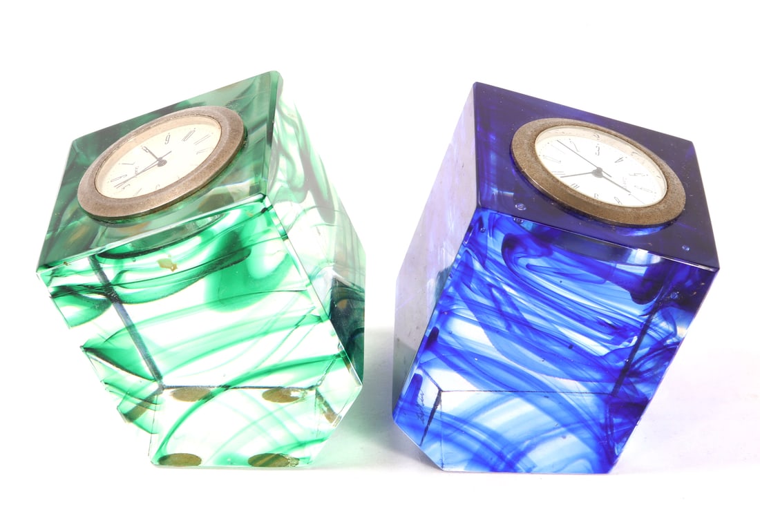 Pair of Beautiful Murano Glass Paperweight Clocks, Moretti: Lovely rare pair of hand made clock paperweights, made by world famous Murano glass artist, Carlo Moretti. Each with a lovely inclusive swirl throughout the glass in an expert wave. One in a lovely