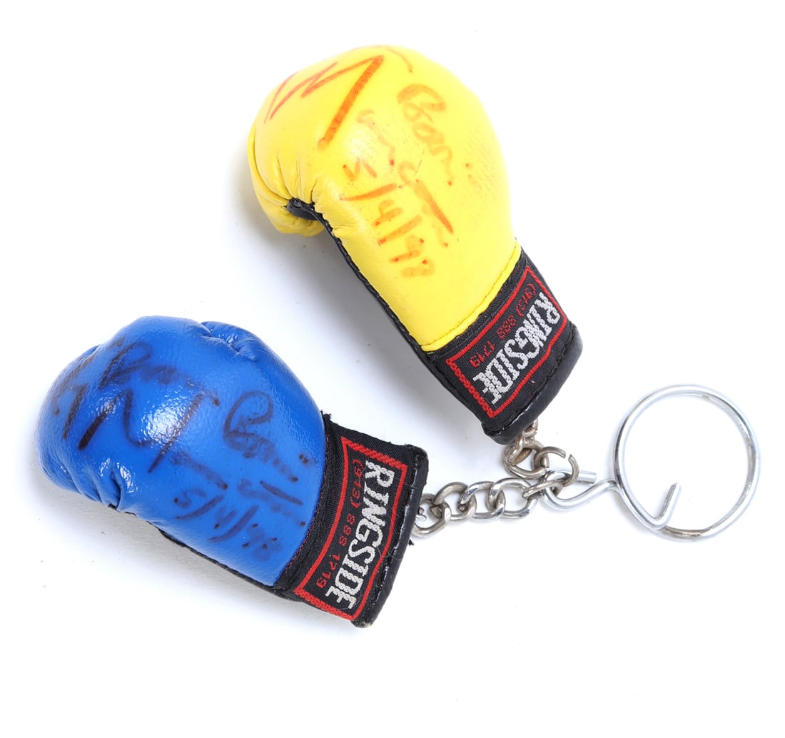 Pair of Miniature Key Chain Boxing Gloves, Signed: Adorable pair of key chain boxing gloves, both signed and dated 5/4/98. Signature appears to read 'Bobby Brown', but unconfirmed. Size Gloves 2 7/8" L