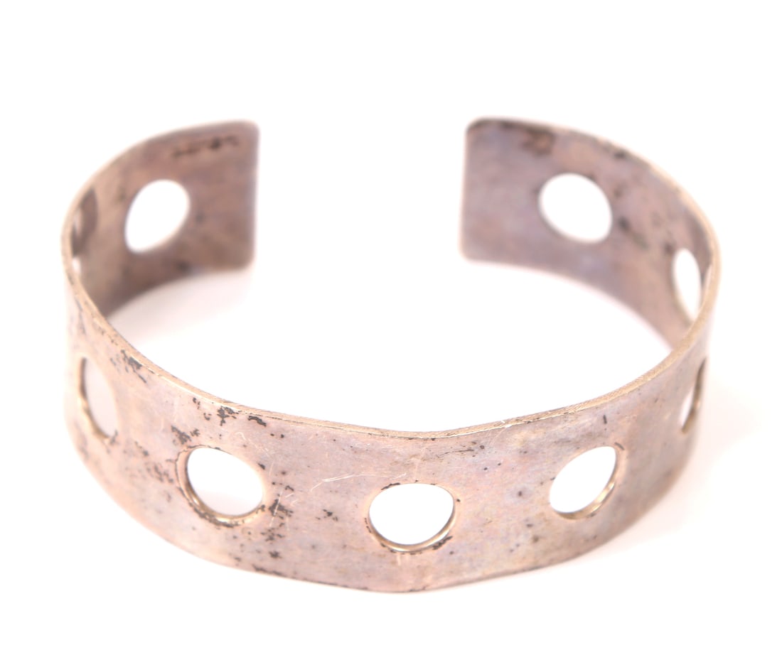 Lovely Handmade Sterling Silver Cuff Bracelet: Handmade sterling silver cuff bracelet with openwork pierced holes throughout creating a fun light cuff. Size 3" L x 2" W, weight 20g