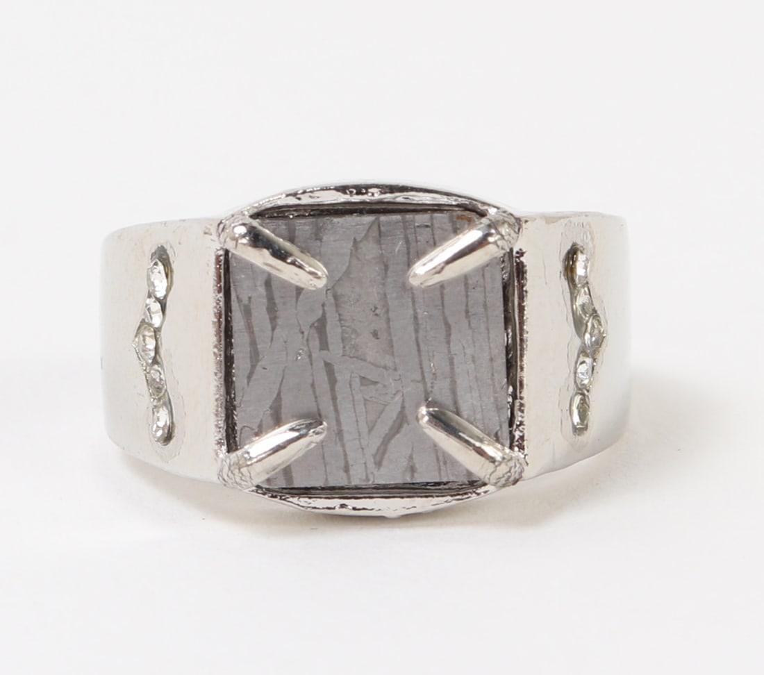 Beautiful Meteorite Slab Ring: Lovely ancient meteorite piece cut into a perfect square slab inset in a silver colored ring that has an adjustable band, with beautiful faux diamond accents. Size 1 1/8" L x 7/8" W , box 2 1/2" H x