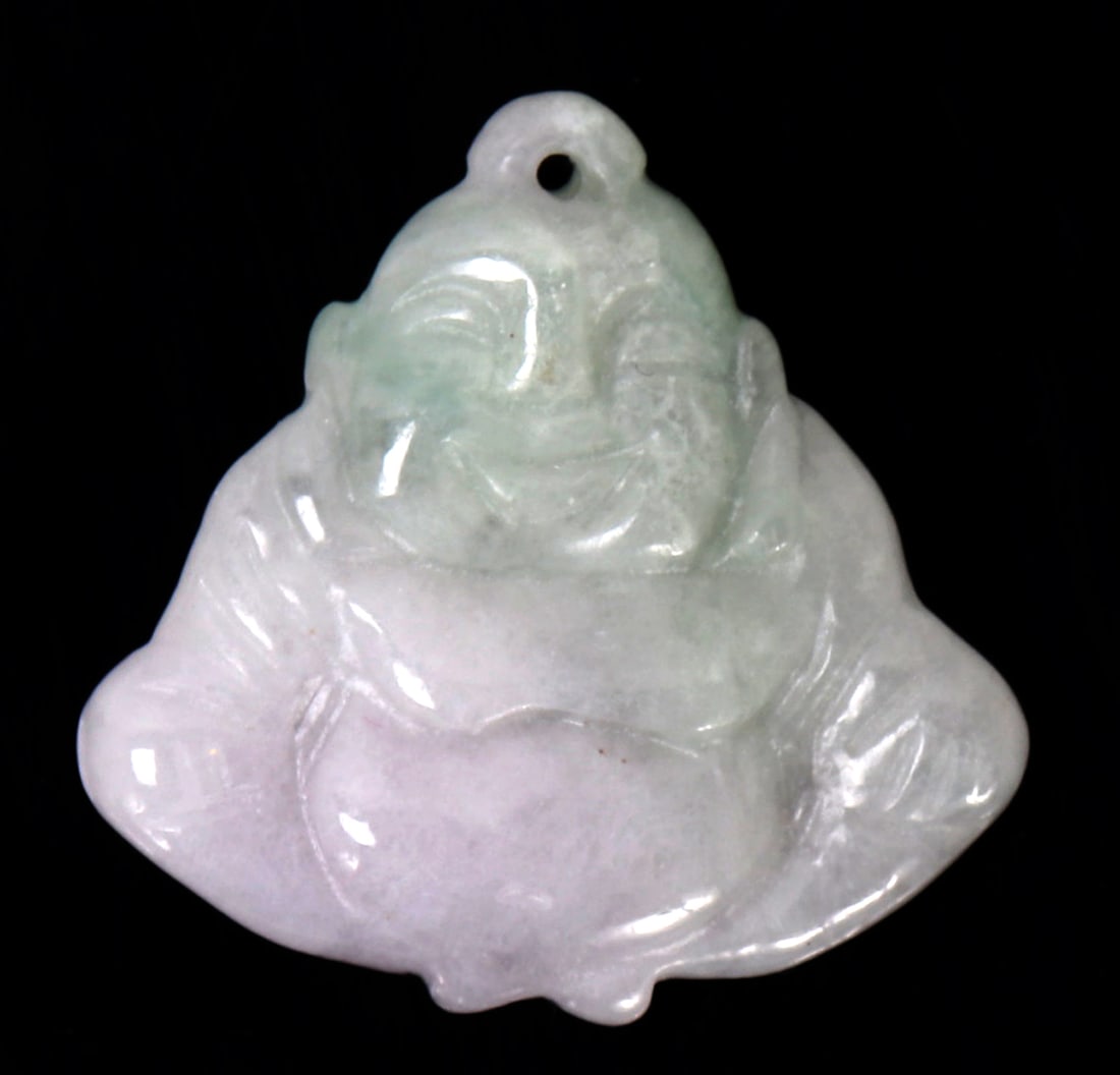 Fine Chinese Buddha Stone Pendant: Chinese jade style pendant depicting a seated buddha smiling with his hands resting on his lap. Pierced to the top for suspension. Size 1 1/4" H x 1/4" W, 8 grams