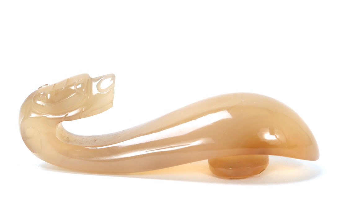 Chinese Mutton Fat Jade Style Belt Hook: Gorgeous light tan and cream white mutton fat jade style belt hook in the shape of a dragon head. Incised details to the dragons face with the belt hook being smooth to the touch. Gorgeous warm