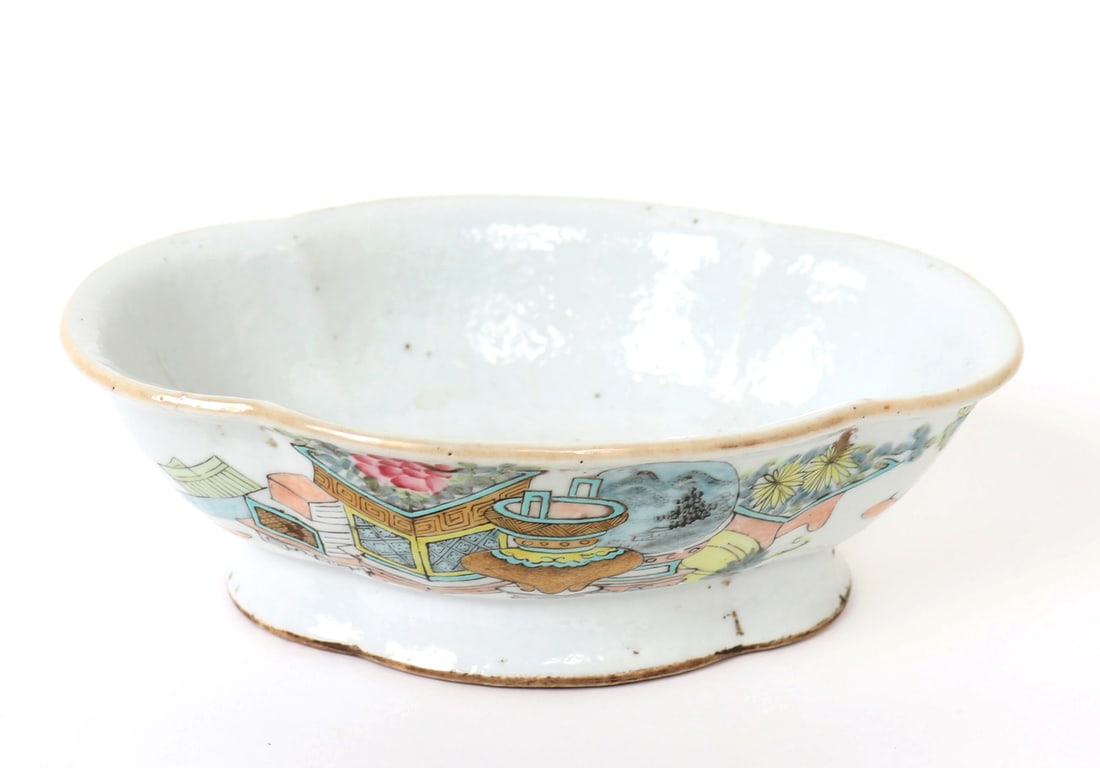 Qing Dynasty Chinese Porcelain Serving Dish: Chinese porcelain recessed serving bowl with painted serving scene to face decorated with fruit filled table and large kiln to face and screen with mountain background. Well aged with various pitting