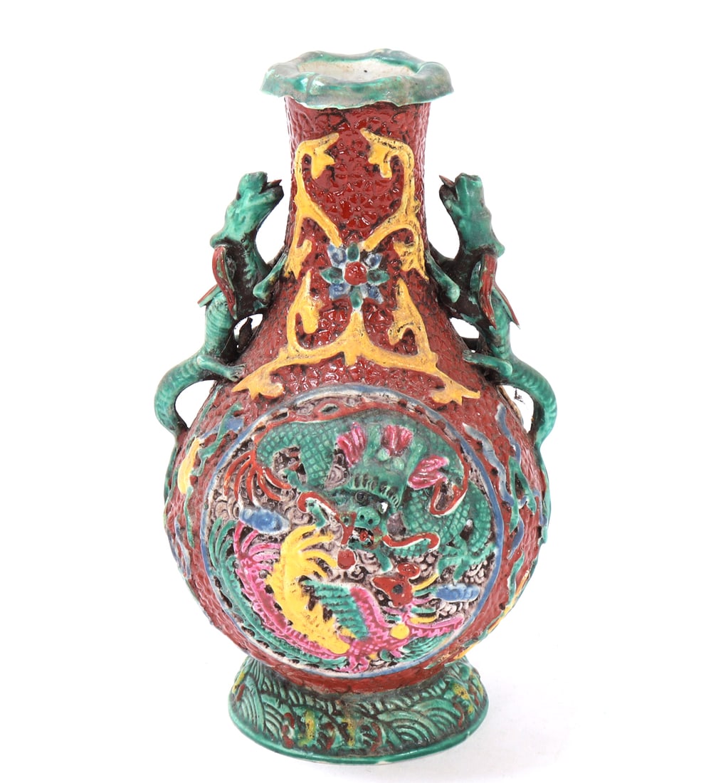 Chinese Red & Green Dragon Vase: Chinese porcelain vase in a flask shape with faux dragon handles crawling up the sides, dragons chase flaming pearls on the face of each side of the vase. Painted all over in red, green, yellow and