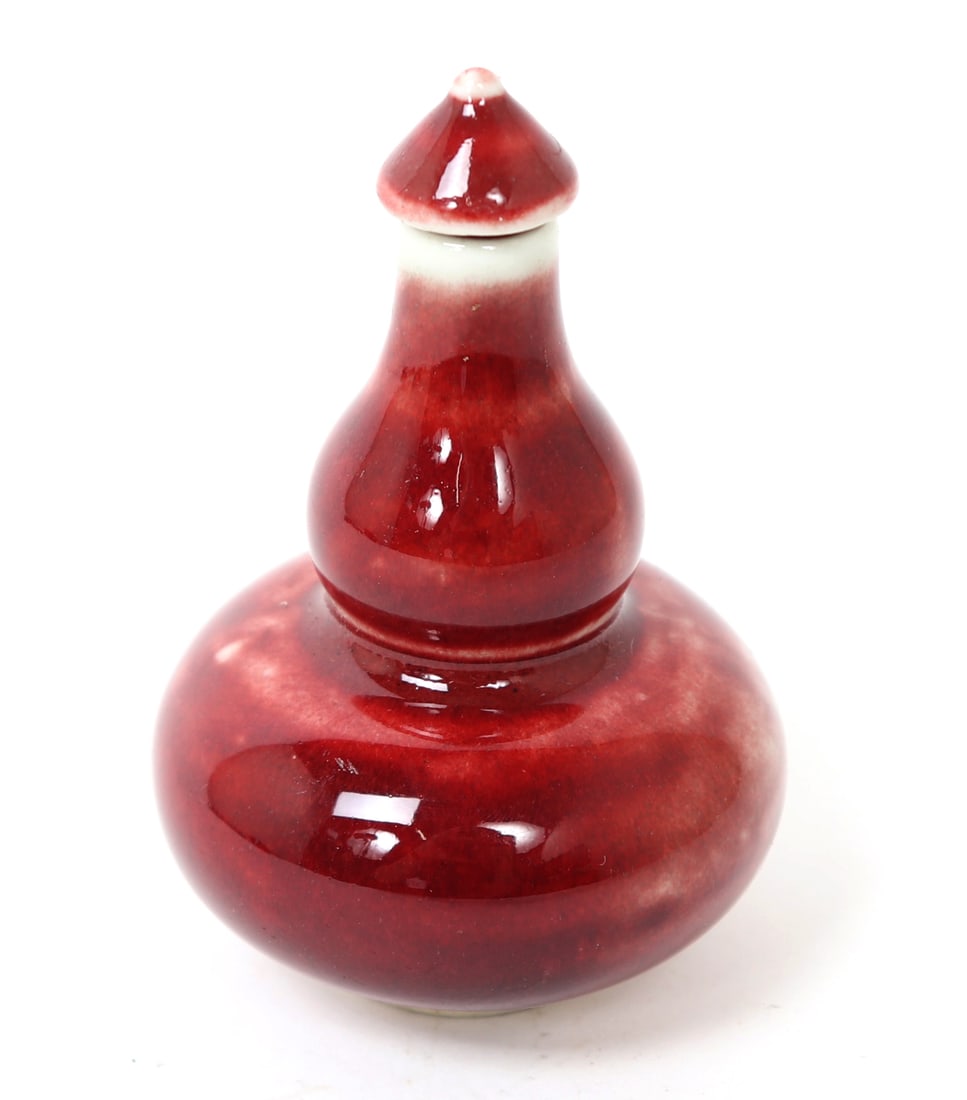 Chinese Ox Blood Gourd Shaped Snuff Bottle: Vintage Chinese porcelain ox blood glazed gourd or hour glass shaped snuff bottle. Marked with a four seal mark to base. Size 3 1/4" H
