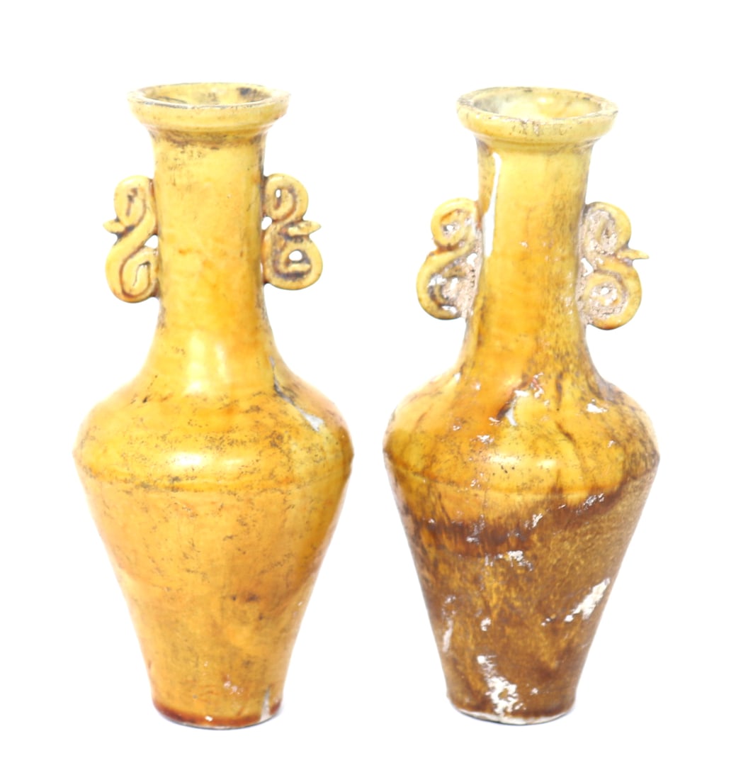 Pair of Chinese Yellow Bottle Vases: Beautiful pair of Chinese yellow glazed vases in bottle form with twin handles of scrolling motif. Size box 10 1/2" W, 4 1/2" H, 8 1/2" D, size of each vase 6 1/2" HEx-Pasadena Collection