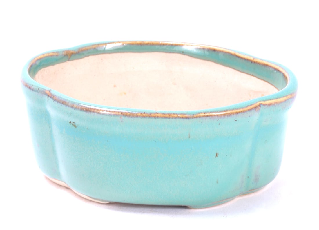 Turquoise Glazed Porcelain Pot: Chinese porcelain planter pot in a lovely turquoise glaze with a lovely gold rim and slight raised foot. Drilled through the base for drainage. Size 5 1/4" L, weight 359 g