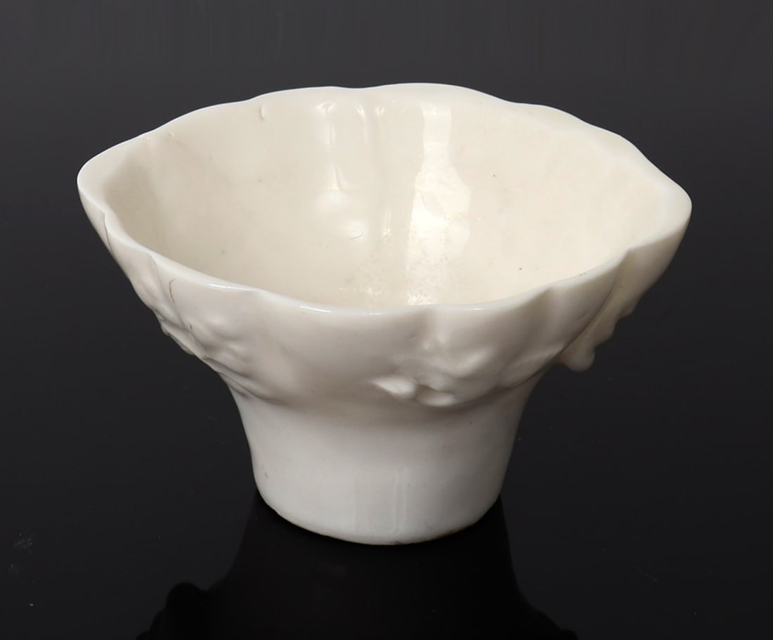 Chinese Blanc de Chine Dish: Chinese porcelain dish with high raised leaf and fruit details to the outer body, with a scalloped rim and raised foot. Size 4 1/4" W x 2 1/4" G