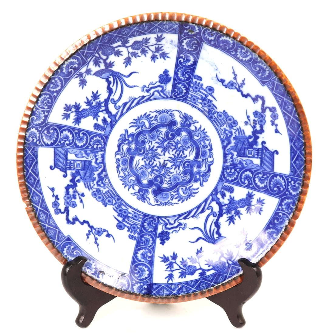 Japanese Blue and White Igezara Plate: Beautifully detailed Japanese igezara, also known as a thorn plate, with blue against a white background. Flowers, trees, temples and birds throughout. Traditional scalloped or piecrust rim. Fainted