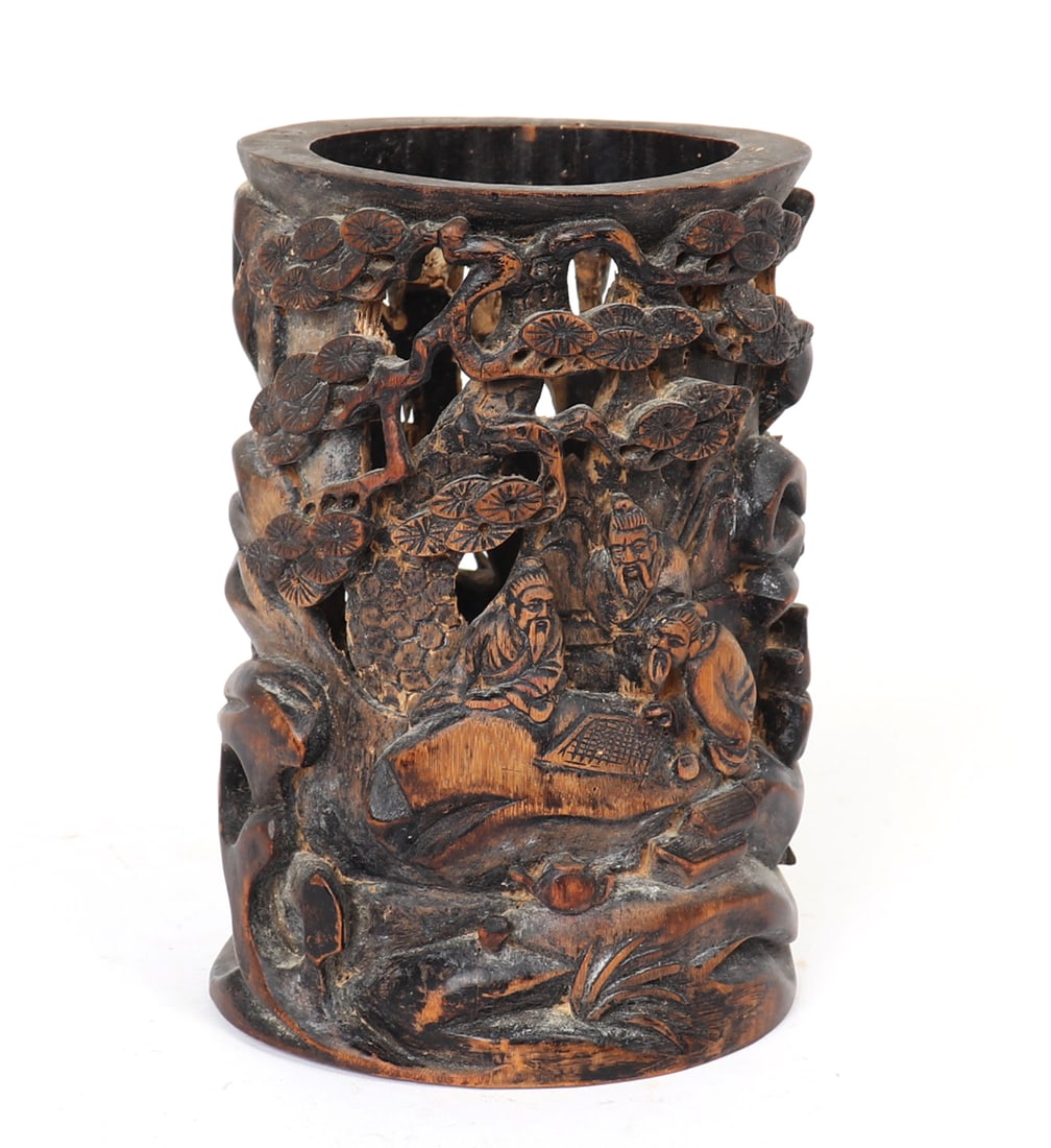 Chinese Wood Carved Brush Holder: Small Chinese wood brush holder with pierced carving throughout. Men among bamboo trees playing a game of Go, a pagoda peaks out from one side. Size 7 3/4" H x 5 7/8" W