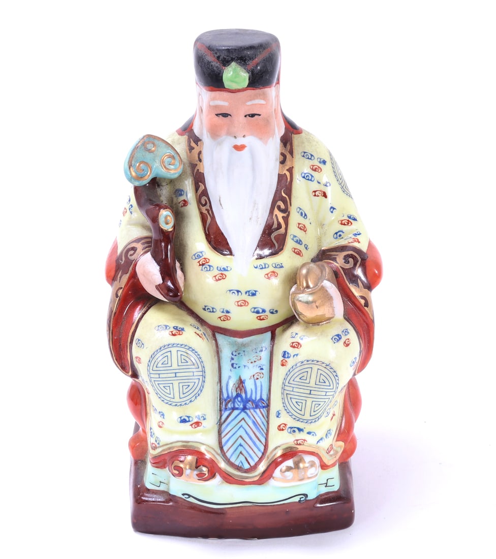 Chinese Porcelain Statue of Tua Pek Kong: Known as the God of Prosperity and a protector, often associated with wealth, good fortune, and safe passage. Depicting seated in a throne with long flowing yellow robes and a Ruyi scepter in one