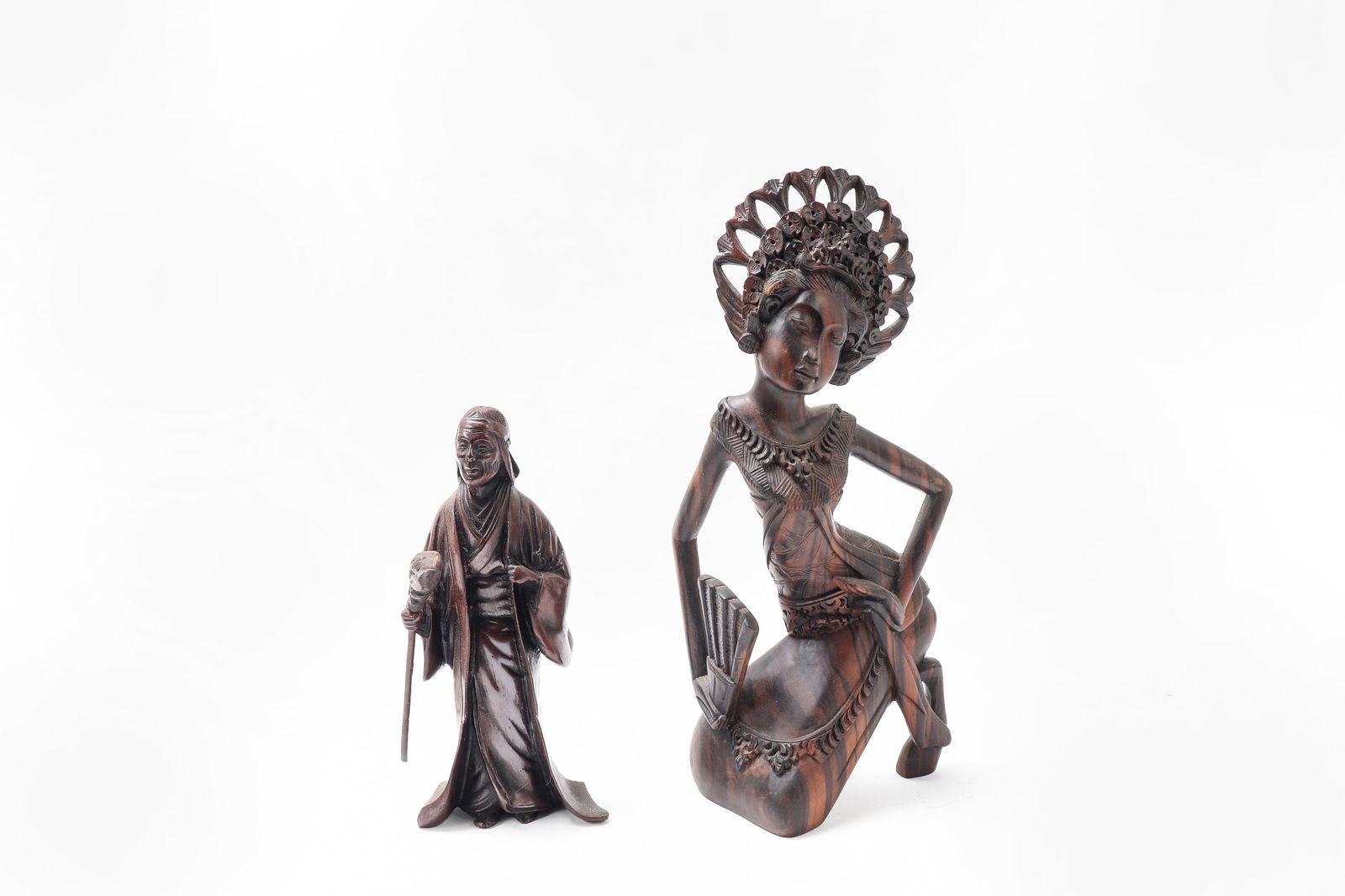 Vintage hand-carved wood figurines: Unusual estate finds of figures including one bronze elder with broom. Right an abstract female probably Japanese. 10" tall by 5" wide 2 pcs