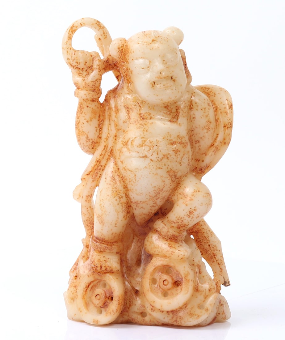 Chinese White Stone Standing Figure: Chinese hardstone carving depicting a man standing on wheels or currency, holding a spear behind his back wearing elaborate style robes. Size 2" L x 5" W x 8 1/2" H, weight 62oz
