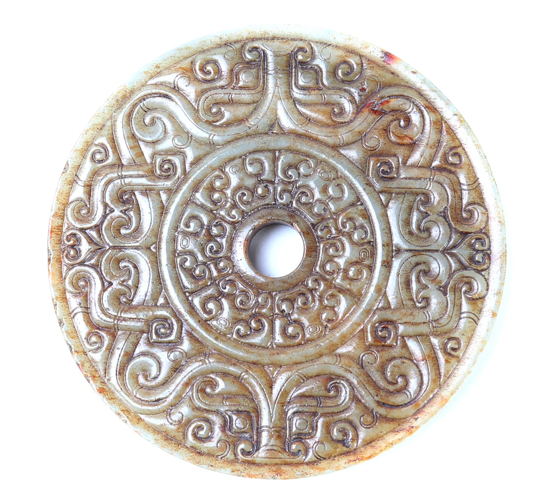 Chinese Jade Carved Bi Disc: Beautiful and intricately detailed Chinese jade bi disc, mottled light green to blood red spots throughout. Incised detailing in a geometric and bamboo style with fruit bats to the center near the