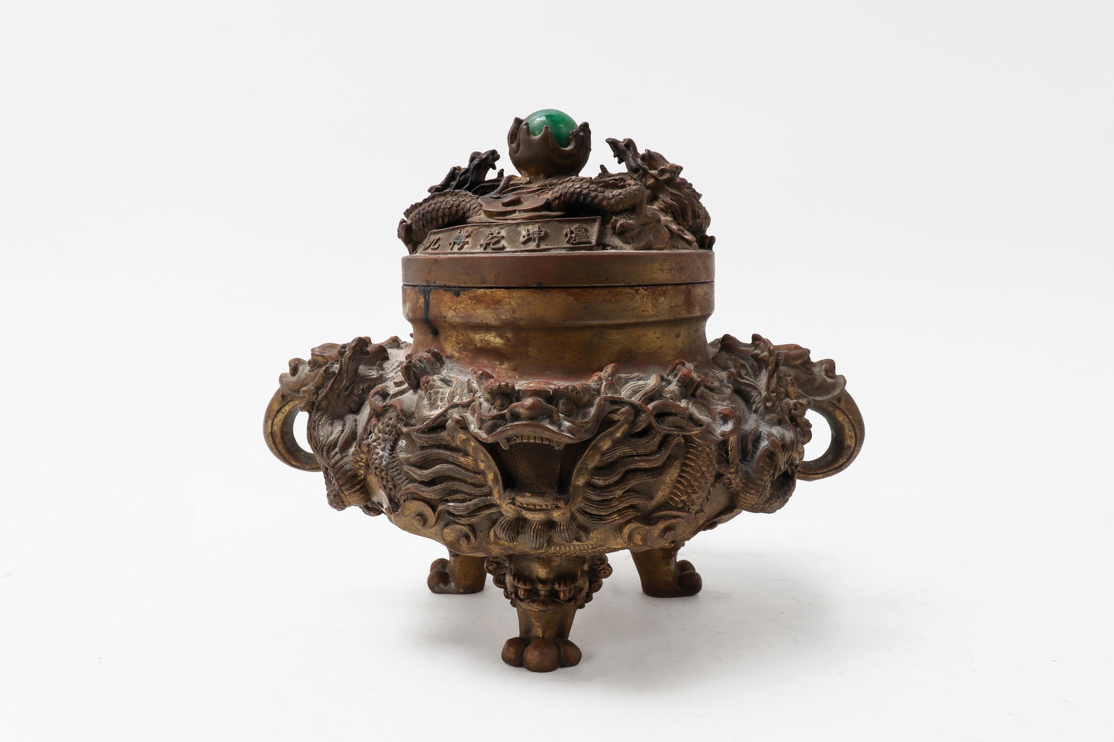 Red Bronze carved Nine Dragon incense burner: Chinese Folklore vessel or censor with pierced openwork lid cast with a band of writing and malachite style orb to the top. Handle in the form of dragon with outstretched tongues and very excentric