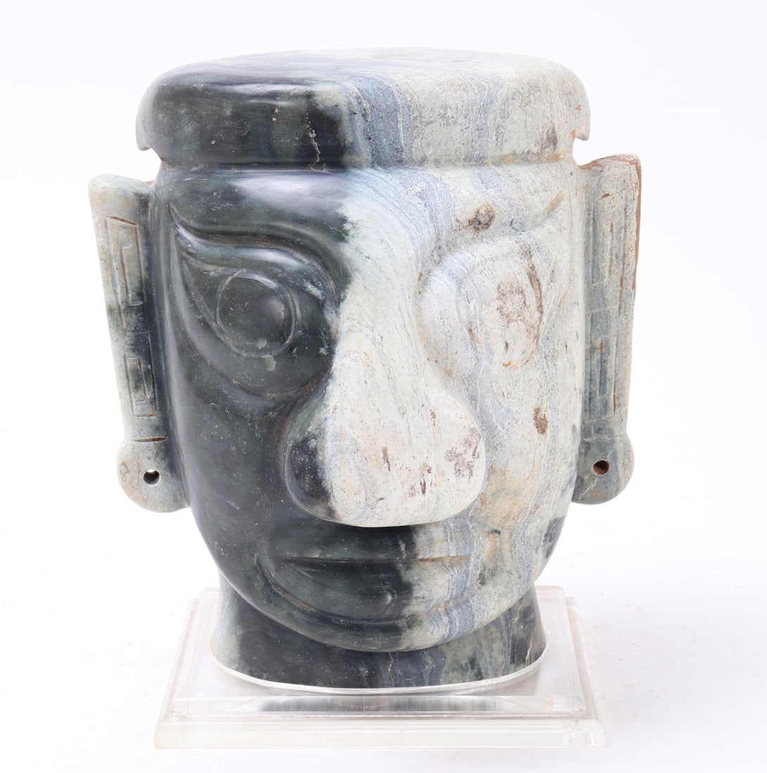 Enormous Chinese Hardstone Carved Head, Nearly 38LBS!: Massive and very heavy Chinese stone carved head in the Neolithic style. Elongated ears, wide nose, and pierced ears mounted on a custom stand. Carved from a black and white colored hardstone or