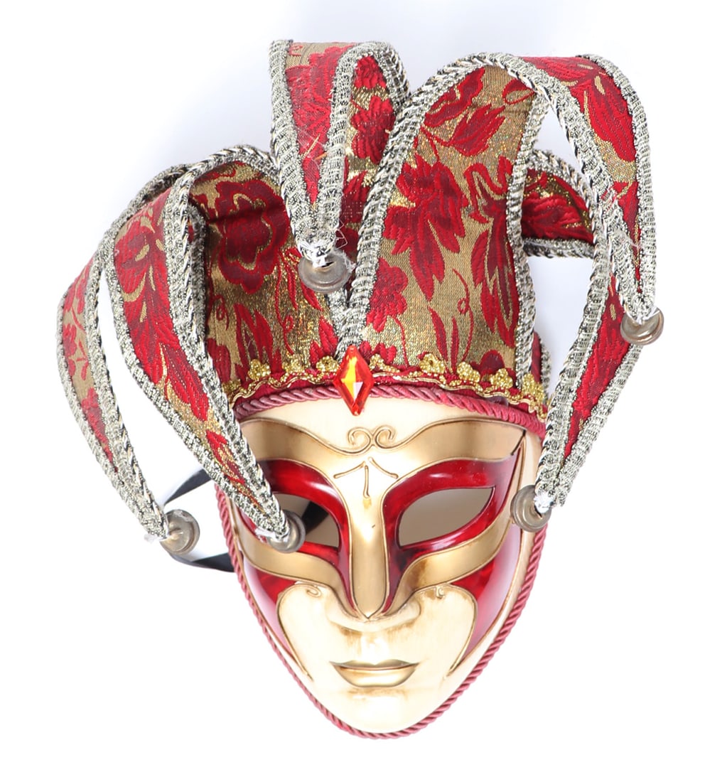 Lively Comedy or Masquerade Mask: Gold and red fabric with a eggshell white painted face comprise this jovial mask, affixed with bells at the tips of the tentacle like fabric detailing. Size 13" H