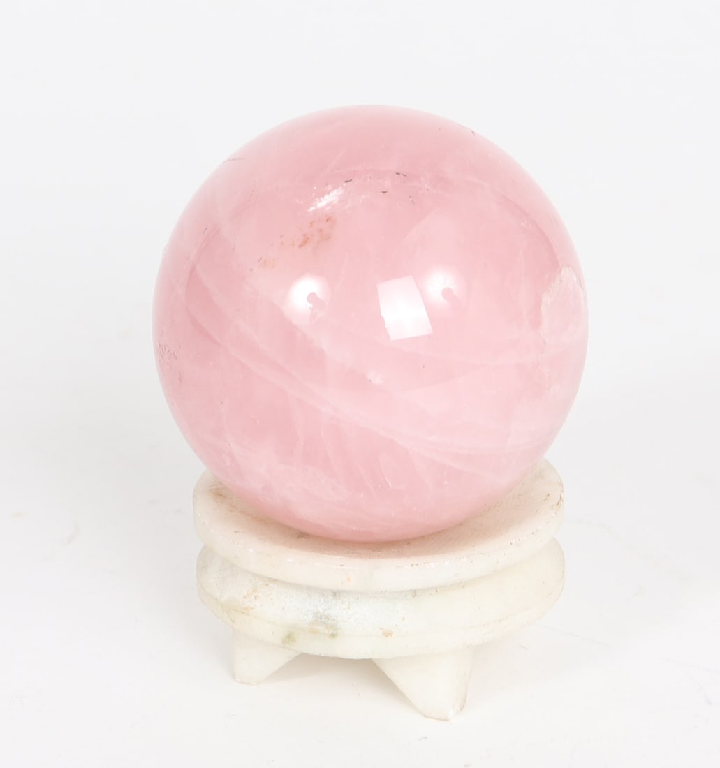 Small Pink Quartz Crystal Ball: Adorable small pink quartz ball with custom stand. Crystal inclusions throughout in a wave like pattern surfing from top left to bottom right. Size 3 5/8" H