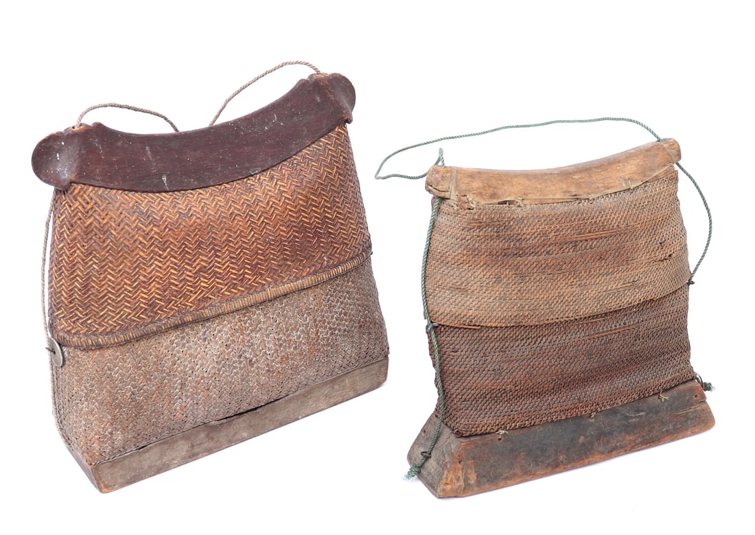 Two Filipino Hand Made Rattan & Bamboo Bags: Wonderful group of two medium sized hand made Filipino bags. Larger with a dark bamboo handle and reinforced base, two tone braided rattan. Smaller with a light bamboo handle and dark bamboo base,