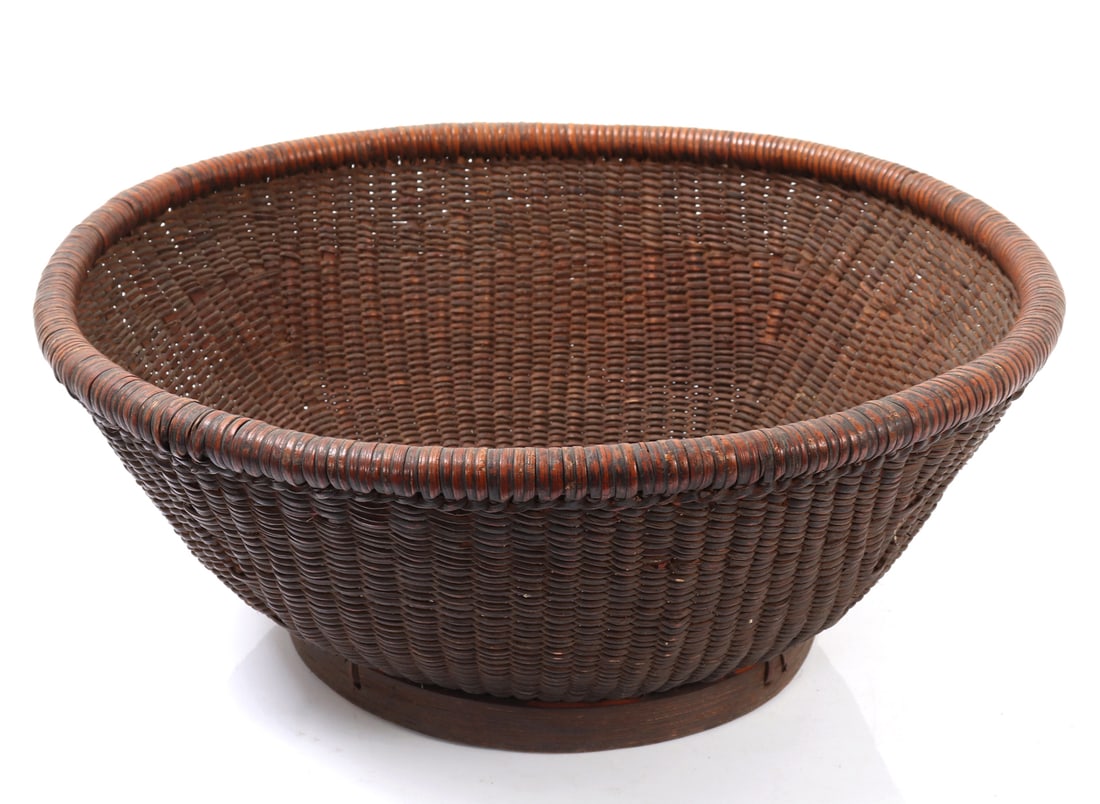 Fine Handmade Filipino Rattan Basket: Large concave handmade rattan storage basket made in the Philippines, oftentimes used to store grains nuts and dried fruits. Size 15 1/2" L x 15 1/2" W weight 435g