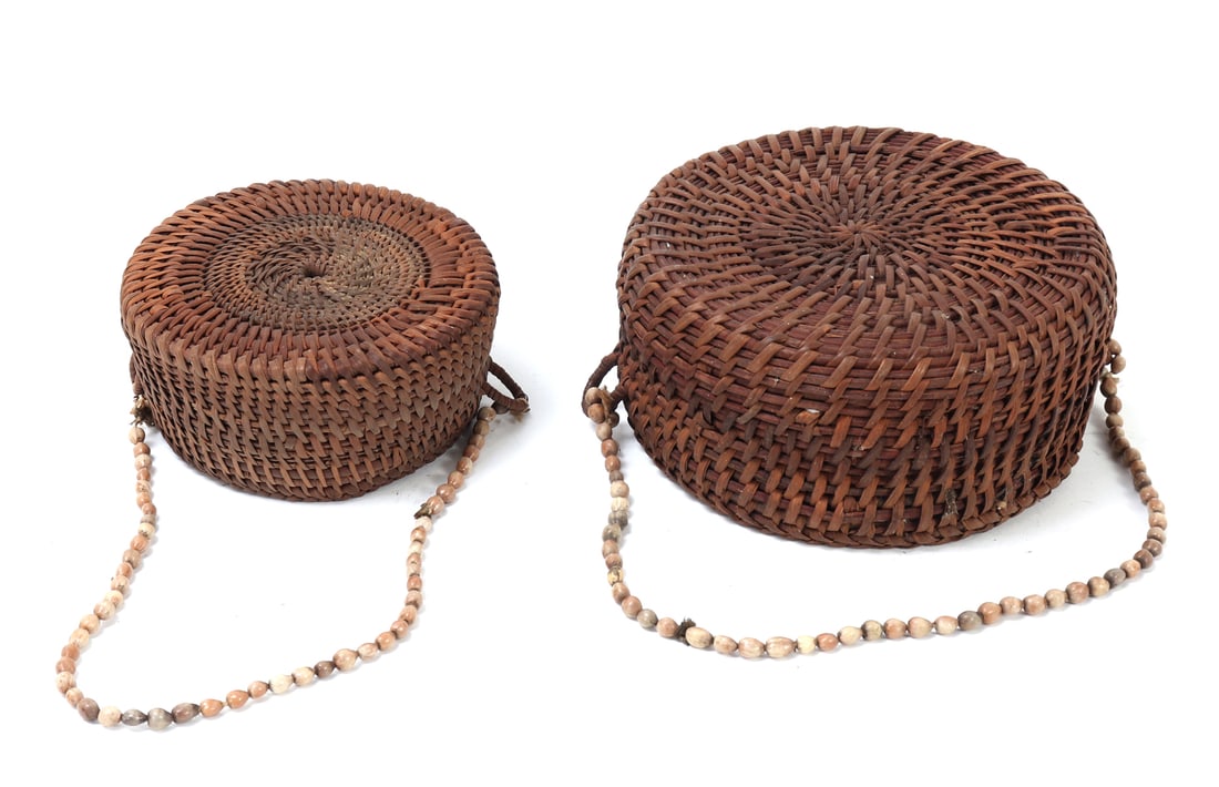 Fine Pair of Handwoven Filipino Hats: Lovely pair of vintage handmade Filipino hats comprised of rattan and bamboo. Each with shell beaded straps in various shades throughout. Size of larger 6 1/8" W