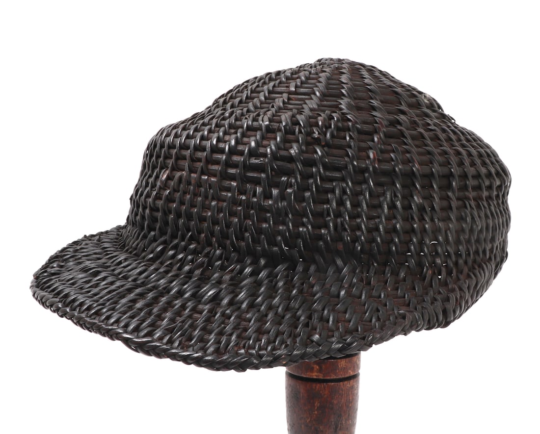 Nice Filipino Rattan Braided Hat: Dark tea dyed braided rattan had from the Philippines, wide front brim for shading eyes and cheeks from the sun. Slightly conical top with wide brim, likely meant for an adult. Size 10 1/8" L x 7 5/8"